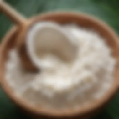 A close-up of fresh coconut milk being extracted from grated coconut flesh