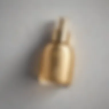 A top view of a setting spray bottle with a luxurious gold cap