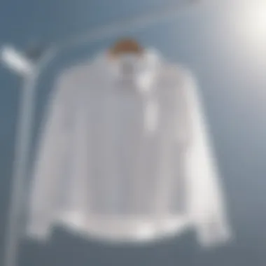 White blouse hanging to dry under the sun